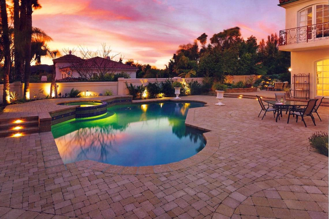 POOL SURROUNDS · STONE PAVING